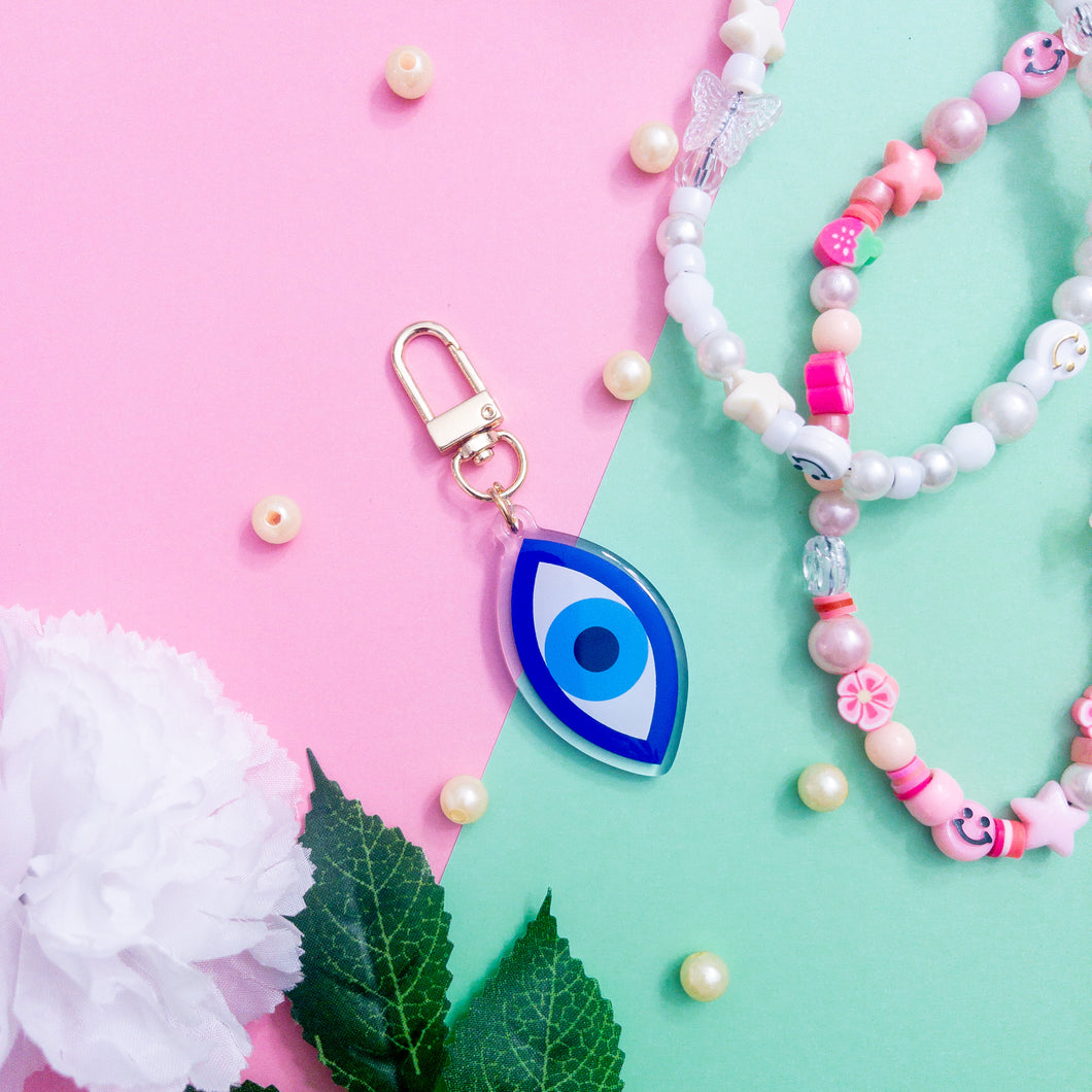 This is a blue Evil Eye Keychain with a gold polished swivel clasp