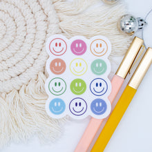 Load image into Gallery viewer, CLEAR Multicolor Smiley Faces Sticker
