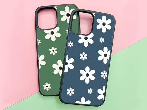 2 Daisy flowers phonecases for iPhone or Samsung. on the left a sage green color and on the right the midnight color 