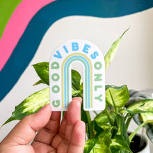 Load image into Gallery viewer, a person holding a Good vibes only sticker over an aesthetic background
