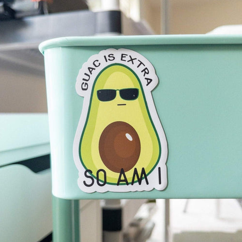 Guac is extra so am i, half avocado with glasses is stuck onto the metal part of craft cart. 